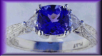 Hand-engraved platinum ring set with a stunning tanzanite.