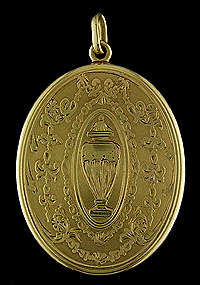14kt gold open locket with mirror.
