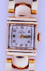 Retro wristwatch with pink and yellow gold puffy links. (J3509)