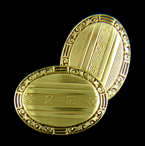Art Deco scroll-and-pinstripe cufflinks crafted in 14kt gold. (J8632)