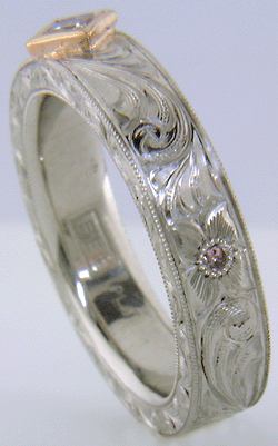 Hand engraved platinum ring with pink diamonds. (MEZA1193)