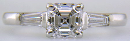 Asscher-cut diamond accented with tapered baguette diamonds set in a handcrafted platinum ring.