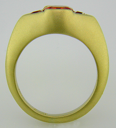Side view of spessartite garnet and tourmaline ring.