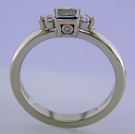 Side view of blue diamond and platinum ring.