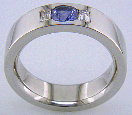 Custom platinum band with burnish set sapphires and diamonds A wedding ring