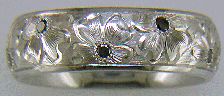 Hand engraved palladium band set with black Diamonds.