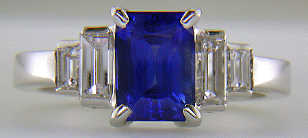 Emerald cut sapphire and diamond hand-crafted platinum ring.