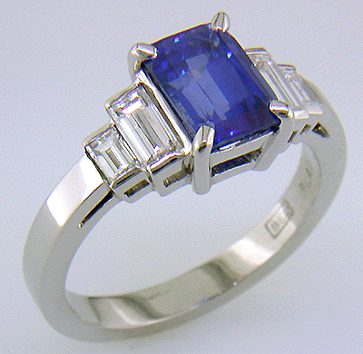 Emerald cut sapphire and diamond hand-crafted platinum ring.