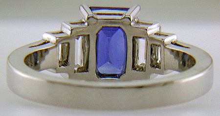 Inside view emerald-cut sapphire and diamond hand-crafted platinum ring.