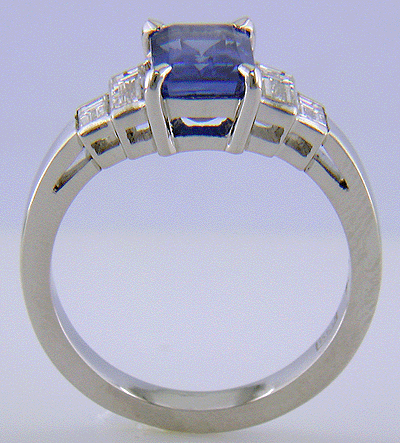 Side view of emerald-cut sapphire and diamond hand-crafted platinum ring.