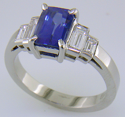 Emerald cut sapphire and diamond hand-crafted platinum ring.
