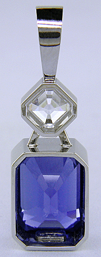 Custom platinum pendant featuring a beautiful Sapphire and an Asscher-cut Diamond.