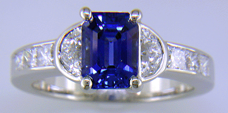 Emerald-cut sapphire and diamond ring in platinum