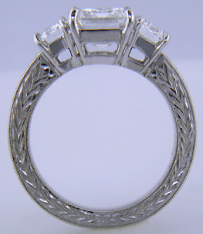 Side view three Emerald-cut Diamonds in a custom platinum ring.