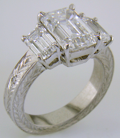 Three Emerald-cut Diamonds in a custom platinum ring.