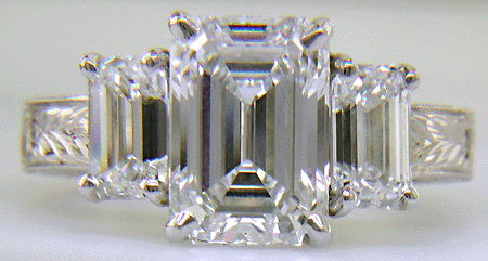 Three Emerald-cut Diamonds in a custom platinum ring.
