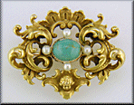 Victorian gold brooch in the ornate Rococo Revival style. (J8460)