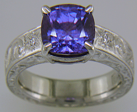 Custom hand-engraved platinum ring with Sapphire.