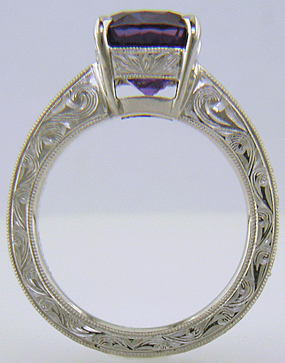 Custom hand-engraved platinum ring with Sapphire.