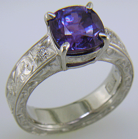 Custom hand-engraved platinum ring with Sapphire.