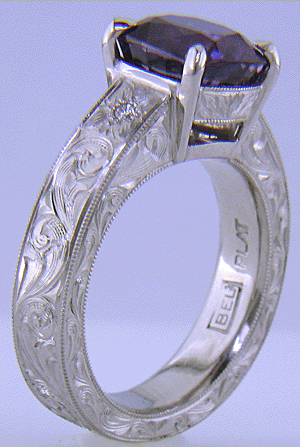 Custom hand-engraved platinum ring with Sapphire.