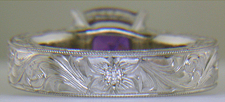 Custom hand-engraved platinum ring with Sapphire.