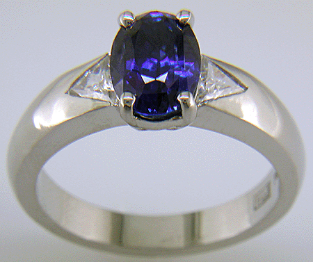 Sapphire and trilliant diamond hand-crafted platinum ring. (J7416)