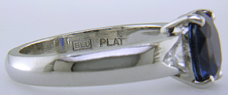 Close-up fo Bijoux Extraordinaire hallmark (BEL). (J7416)