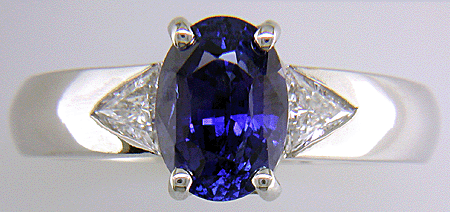Sapphire and trilliant diamond hand-crafted platinum ring. (J7416)