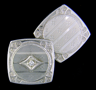 Antique white gold and diamond cufflinks. (J8610)