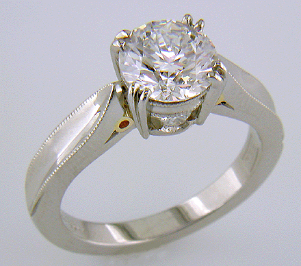 Platinum diamond ring with 18kt gold accents.