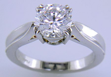 Platinum diamond ring with 18kt gold accents.