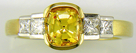 Fancy yellow sapphire and diamond ring.