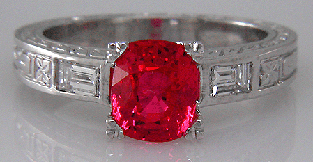 A custom platinum ring with flame red spinel and baguette diamonds.