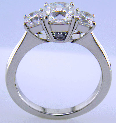 Side view of three Flanders cut diamonds in a custom platinum ring.