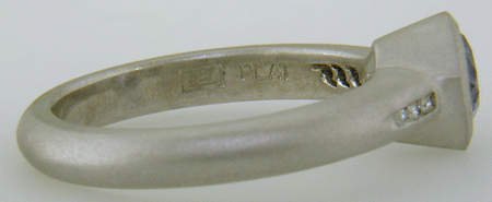 Close-up fo Bijoux Extraordinaire hallmark (BEL).