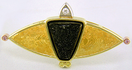 Custom brooch featuring drusy Psilomelane with fancy pink and yellow diamonds in 24 kt yellow gold.