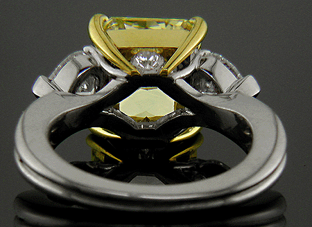 Inside view of platinum anniversary ring with a fancy yellow diamond.