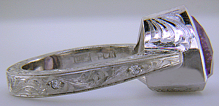 Close-up fo Bijoux Extraordinaire hallmark (BEL). (J7415)