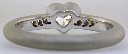 Inside view of Heart-shape Diamond with round Fancy Vivid Pink Diamonds in a custom platinum ring.