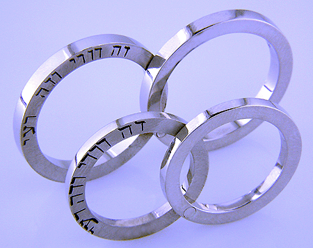 Hebrew inscription in custom wedding bands.