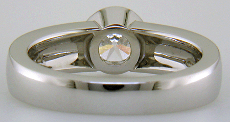 Inside of custom platinum diamond ring with 18kt infinity symbols.