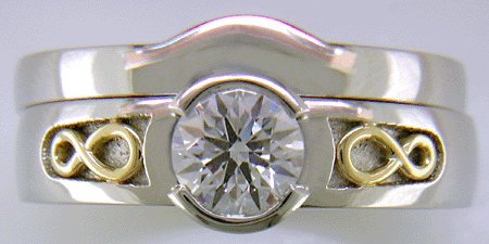 Custom platinum diamond ring with matching contoured wedding band.