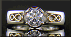 Custom platinum diamond ring with 18kt infinity symbols.