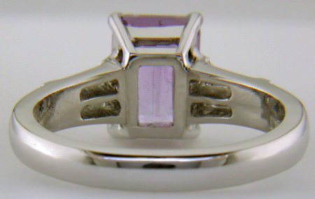 Inside view of hand-crafted platinum ring with Lavender Sapphire set with tapered baguette diamonds.