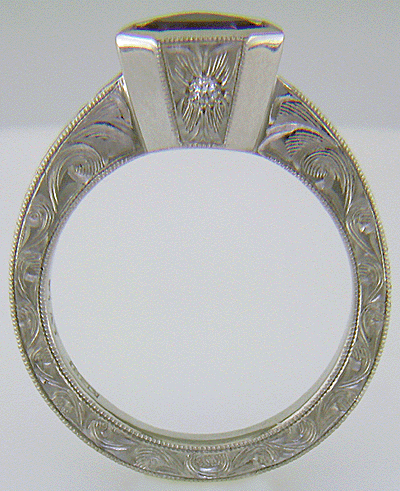 Hand engraved platinum ring with a shield-shape Lavender Spinel. (J8710)