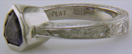 Close-up of Bijoux Extraordinaire (BEL) hallmark.