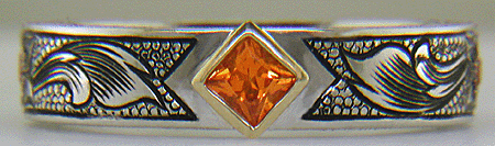A beautifully hand-engraved ring set with fiery orange Manderin Garnets. (J8703)
