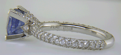 Close-up of Bijoux Extraordinaire hallmark (BEL) and platinum mark.