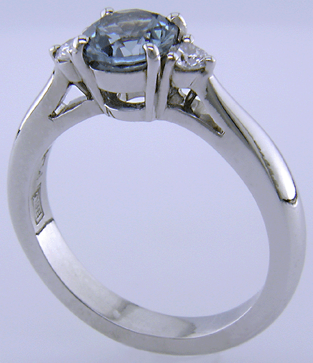 Montana Sapphire set with two round diamonds in a hand-crafted platinum ring.